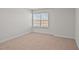 Simple bedroom with neutral walls, carpet, and a window with blinds at 1104 Middlecrest Dr, Rocky Mount, NC 27804