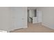 Hallway with carpet, doors to bedrooms and stairs at 1104 Middlecrest Dr, Rocky Mount, NC 27804