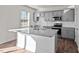 Modern kitchen with island, gray cabinets, and granite countertops at 1104 Middlecrest Dr, Rocky Mount, NC 27804