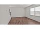 Spacious living room with wood-look floors and views of the kitchen at 1104 Middlecrest Dr, Rocky Mount, NC 27804