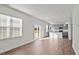 Open living room and kitchen with wood-look floors and sliding glass doors at 1104 Middlecrest Dr, Rocky Mount, NC 27804