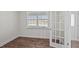 Bright office with wood-look floors, a window, and French doors at 1104 Middlecrest Dr, Rocky Mount, NC 27804