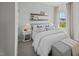 Guest bedroom with window, neutral decor, and a cozy sitting area at 1113 Middlecrest Dr, Rocky Mount, NC 27804