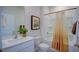 Clean bathroom with a shower/tub combo, white vanity, and a window at 1116 Middlecrest Dr, Rocky Mount, NC 27804
