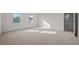 Bright bedroom featuring carpeted floors and a walk-in closet at 1121 Middlecrest Dr, Rocky Mount, NC 27804