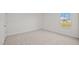 Well-lit bedroom with carpeted floor and a large window at 1121 Middlecrest Dr, Rocky Mount, NC 27804