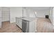 Open concept kitchen with island, stainless steel dishwasher and pantry at 1121 Middlecrest Dr, Rocky Mount, NC 27804