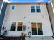 Back exterior of the house with sliding glass doors and small patio at 1134 Chestnut Bluff, Apex, NC 27502