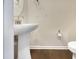 Clean bathroom with pedestal sink, toilet and updated fixtures at 1134 Chestnut Bluff, Apex, NC 27502