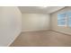 Well-lit bedroom featuring neutral walls and carpet flooring at 1134 Chestnut Bluff, Apex, NC 27502