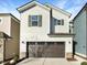Two-story house with neutral siding, brown garage door, and landscaping at 1134 Chestnut Bluff, Apex, NC 27502