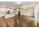Eat-in kitchen with white cabinets, granite countertops, and stainless steel appliances at 1134 Chestnut Bluff, Apex, NC 27502