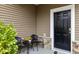 Small front porch with two wicker chairs and a small table at 116 Rosebud Lane Ln, Durham, NC 27704