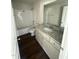 Bathroom with granite countertop, tub, and toilet at 148 Phil Jack Rd, Dunn, NC 28334