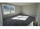 Bright bedroom with carpet flooring and a large window at 148 Phil Jack Rd, Dunn, NC 28334