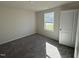 Simple bedroom with neutral walls and carpet at 148 Phil Jack Rd, Dunn, NC 28334