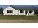 Newly built home with front yard and stone accents at 148 Phil Jack Rd, Dunn, NC 28334