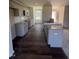 Open kitchen with granite countertops and dark floors at 148 Phil Jack Rd, Dunn, NC 28334