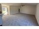 Spacious living room with neutral carpet and high ceilings at 148 Phil Jack Rd, Dunn, NC 28334
