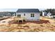Exterior shot of the backyard and back deck of a home with light siding and dark roof at 150 Brookhaven Dr, Spring Hope, NC 27882