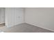 This bedroom features neutral walls, carpet, and a double-door closet at 150 Brookhaven Dr, Spring Hope, NC 27882