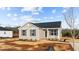 Attractive single-story home with neat landscaping, dark roof and neutral siding at 150 Brookhaven Dr, Spring Hope, NC 27882