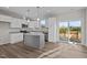 Bright, open kitchen with stainless steel appliances and access to an outdoor deck at 150 Brookhaven Dr, Spring Hope, NC 27882