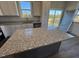 Spacious kitchen island with granite countertop, offering extra prep space at 150 Brookhaven Dr, Spring Hope, NC 27882