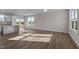 Open concept living area features hardwood floors, large windows, and modern finishes at 150 Brookhaven Dr, Spring Hope, NC 27882