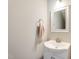 Small half-bathroom with sink, mirror, and white vanity at 1500 Treetop Ln, Rocky Mount, NC 27804