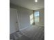 Spacious bedroom with carpet and large window at 158 Pate Landing Dr, Selma, NC 27576