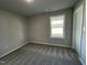 Bright bedroom with carpet flooring and large window at 158 Pate Landing Dr, Selma, NC 27576