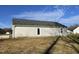 Rear exterior view of house and yard at 158 Pate Landing Dr, Selma, NC 27576