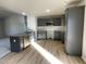 Modern kitchen with grey cabinets and granite countertops at 158 Pate Landing Dr, Selma, NC 27576