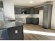 Modern kitchen with grey cabinets, granite countertops, and stainless steel appliances at 158 Pate Landing Dr, Selma, NC 27576