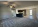 Open concept living space with kitchen view and grey carpet at 158 Pate Landing Dr, Selma, NC 27576