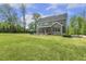 Spacious yard with patio, screened in porch, and manicured lawn at 1625 Banks View Dr, Raleigh, NC 27603