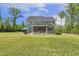 Lush backyard showcasing a patio with a dining set, lounge areas, and ample space for recreation at 1625 Banks View Dr, Raleigh, NC 27603