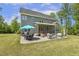 Spacious backyard boasts a dining area and multiple lounge areas for outdoor relaxation and social gatherings at 1625 Banks View Dr, Raleigh, NC 27603