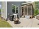 Cozy back patio with a fire pit and a screened-in porch for outdoor relaxation and entertainment at 1625 Banks View Dr, Raleigh, NC 27603