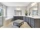 Spacious bathroom featuring dual sinks, garden tub, and separate shower with decorative tiling at 1625 Banks View Dr, Raleigh, NC 27603