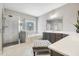 Luxurious bathroom featuring a soaking tub, glass-enclosed shower, and dual vanities at 1625 Banks View Dr, Raleigh, NC 27603