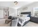 Bedroom featuring a large bed, neutral tones, and ample natural light, creating a serene and inviting atmosphere at 1625 Banks View Dr, Raleigh, NC 27603