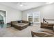 Spacious bonus room with large sectional sofa offering comfort and relaxation for Gathering time or entertaining guests at 1625 Banks View Dr, Raleigh, NC 27603