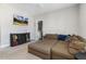 Well-lit bonus room with media center and large sectional providing versatile space for entertainment and relaxation at 1625 Banks View Dr, Raleigh, NC 27603