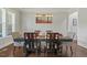 Open dining room offers a large table with seating for six under a modern pendant light at 1625 Banks View Dr, Raleigh, NC 27603
