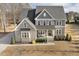 Charming home featuring stone accents, a welcoming front porch, and well-manicured landscaping at 1625 Banks View Dr, Raleigh, NC 27603