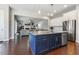 Open concept kitchen featuring granite countertops, stainless steel appliances, and seamless access to the living room at 1625 Banks View Dr, Raleigh, NC 27603