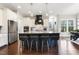 Kitchen features an island with bar stool seating and stainless steel appliances at 1625 Banks View Dr, Raleigh, NC 27603