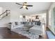 Open living room features a large sectional sofa, and hardwood floors at 1625 Banks View Dr, Raleigh, NC 27603